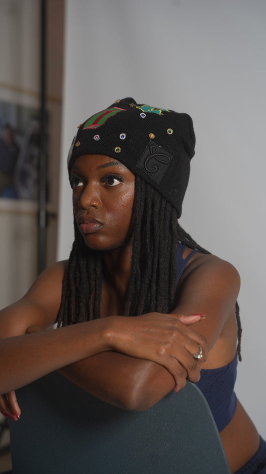 CIC gemstone beanie in black, showing the C crest patch and gemstones