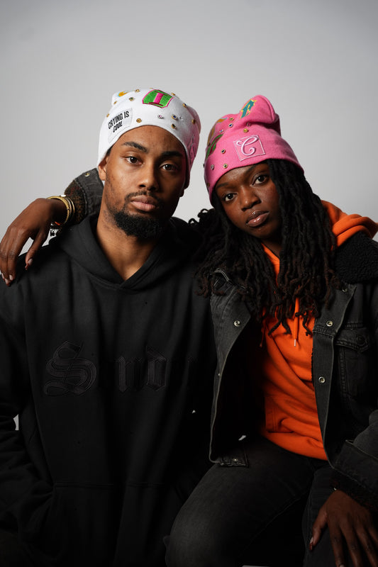 White and pink CIC gemstone beanies worn together