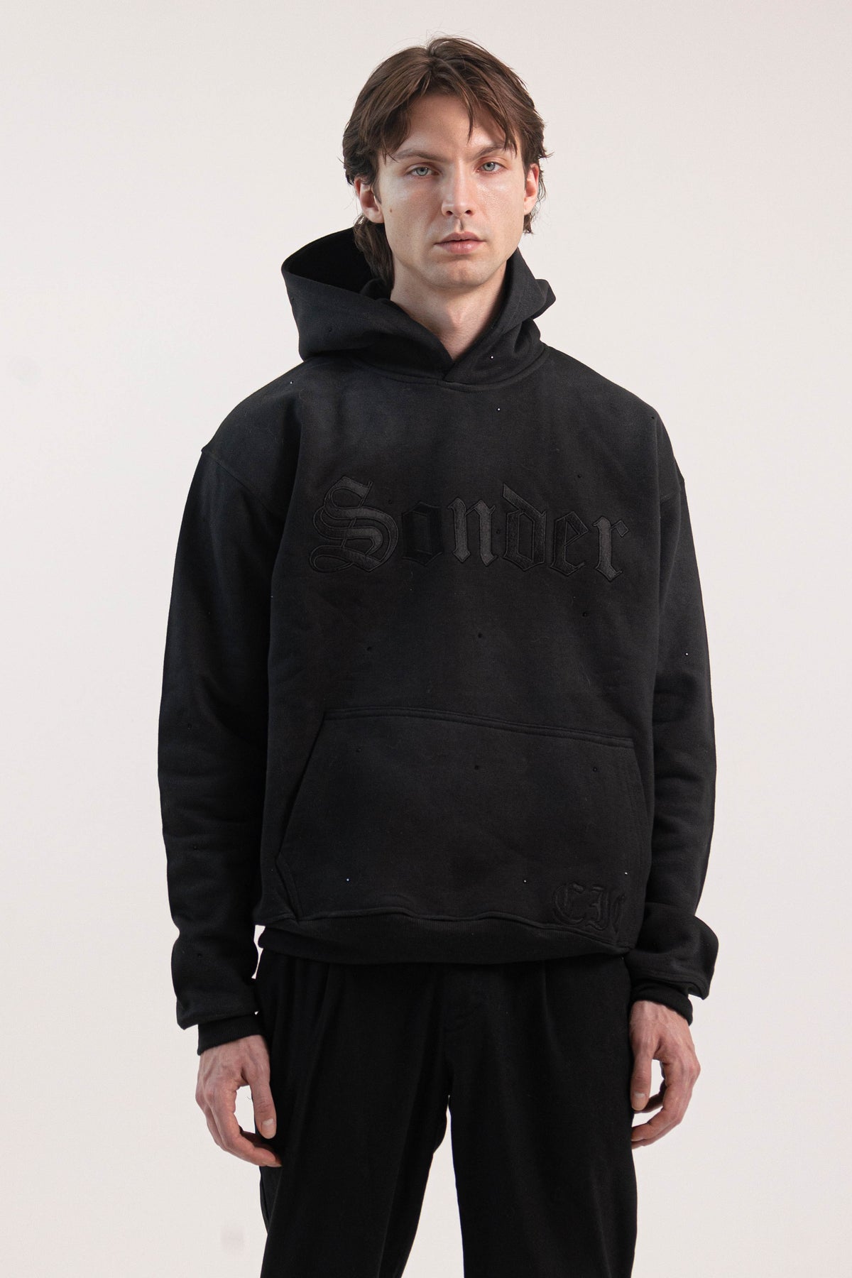 Sonder Rhinestone Hoodie in Washed Black - chest embroidery close-up